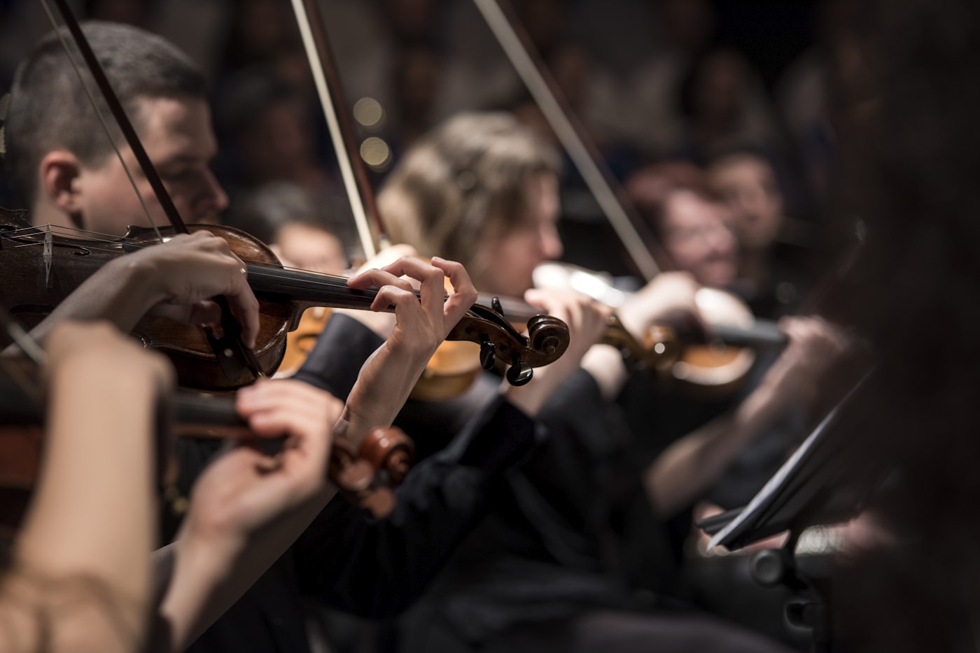 A string quartet performing in warm light